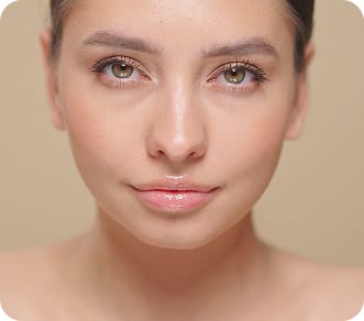 Woman with smooth, radiant skin after regenerative treatment